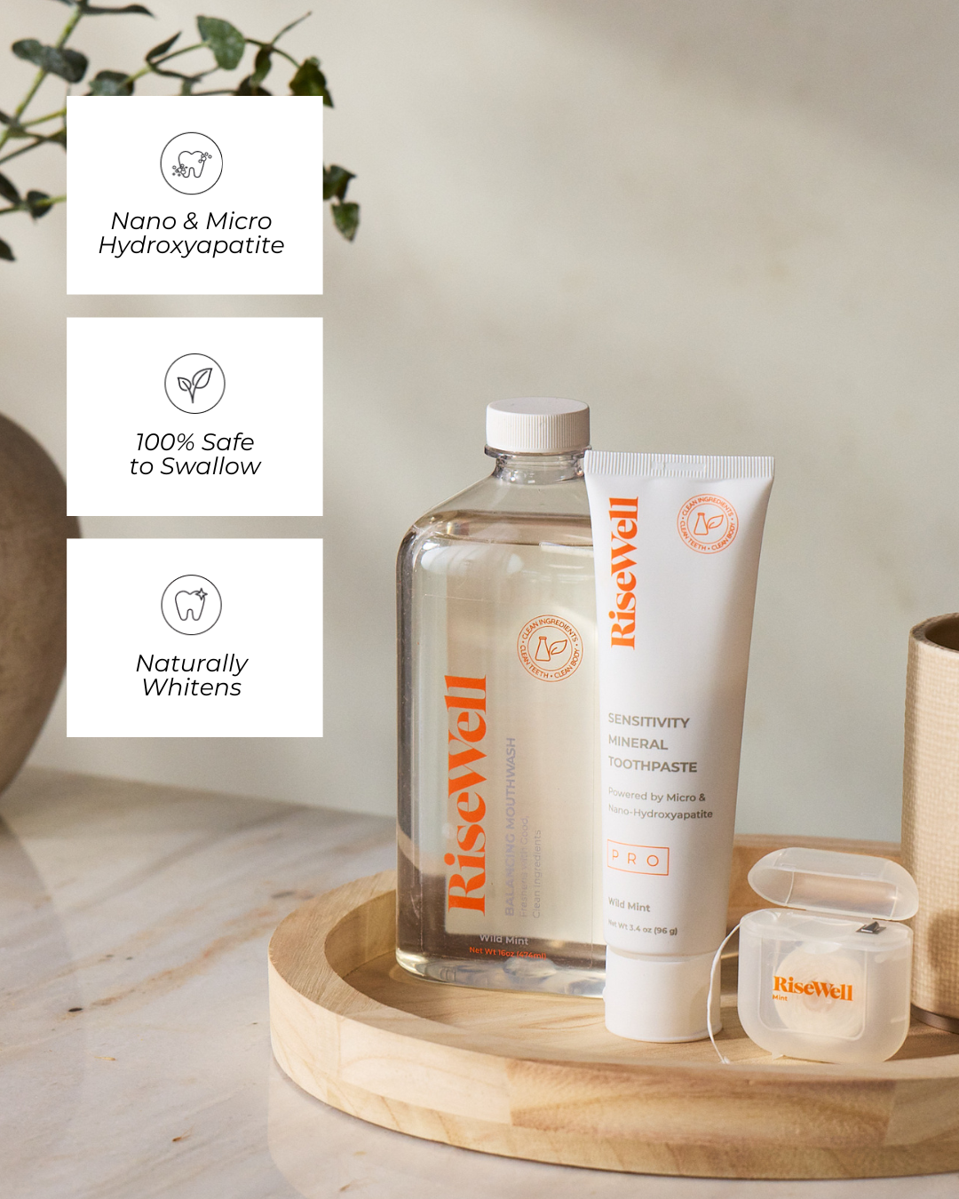 RiseWell dental care products on a wooden tray.